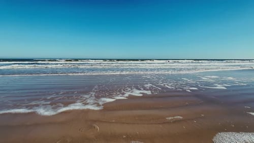 Daytona Beach ocean waves rolling onto sandy Florida shoreline