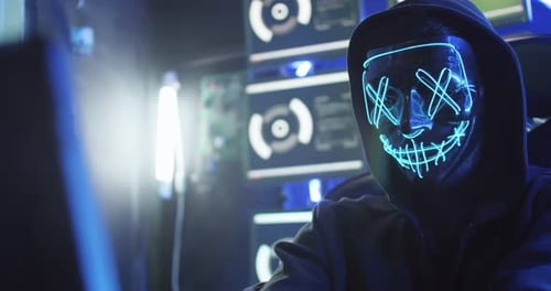 Anonymous Hacker Wearing a Light Up Mask