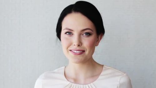 Smiling Woman Posing Confidently in a Close Up Shot