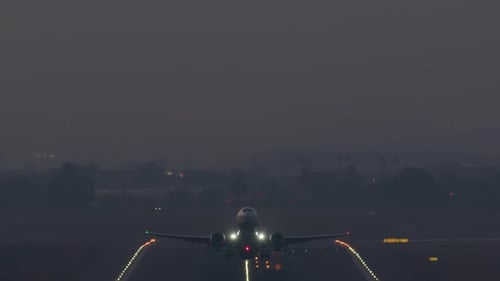 Dusk Takeoff Frontal Airplane Shot