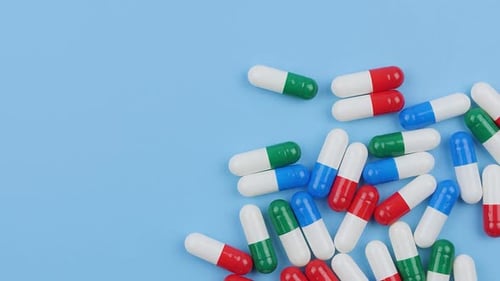 Pharmaceutical Pills on Blue Background