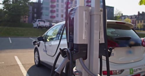 Electric Vehicle Charging Port Plugging in EV Modern Car