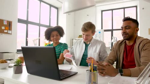 Design Team Collaborating on a Mobile App Interface