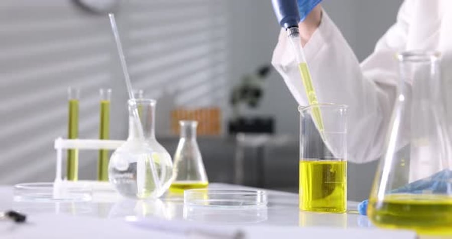 Scientist Testing Samples in Laboratory with Yellow Liquid, Lifestyle ...