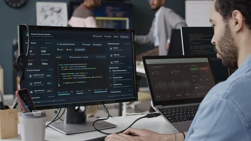 Black Man Software Developer Coding on Computer in Office