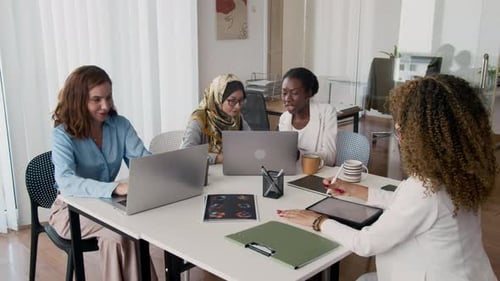 Business Women Having Meeting In Office