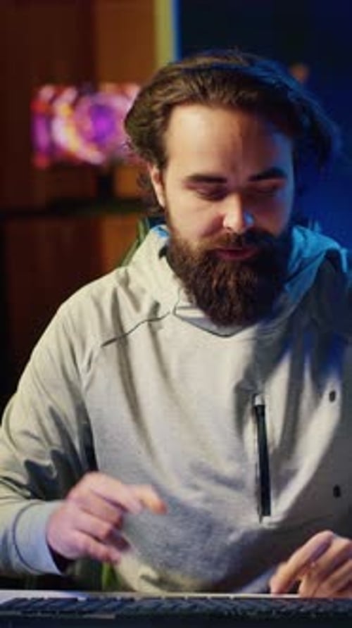 Young Adult Broadcasting at Home Talks to Camera