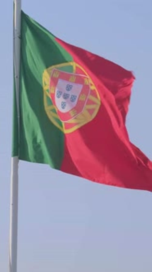 National Flag of Portugal Waving in the Wind on Clear Sunny Day at Blue Sky Real Footage Portugal