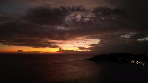 Dramatic Sky Sundown Timelapse Colorful Cloudscape Over Dark Silhouette Coastline Ocean Waves