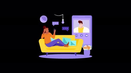 Una joven africana en un sofá disfrutando de una videollamada.