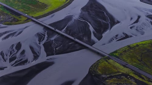 Aerial View of Bridge Over Braided Glacial River in Iceland