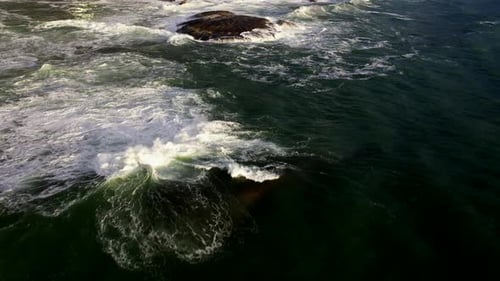 Cinematic Aerial Tilt up Shot of Cape Town's Camps Bay Beach with Table Mountain in the Background a