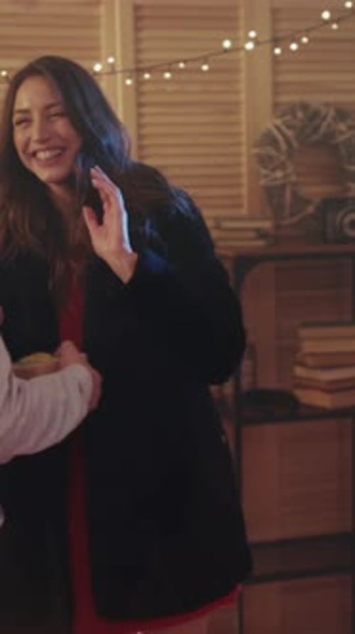 Friends Giving Gifts at Christmas Celebration Party