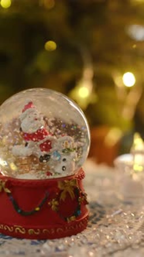 Vertical Video Christmas Background with Cozy Atmosphere Christmas Snow Globe