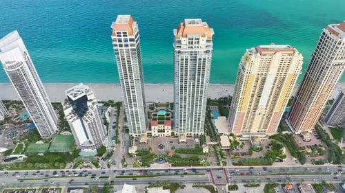 High View of Sunny Isles Beach City with Heavy Urban Traffic and Expensive Highrise Hotels and Condo