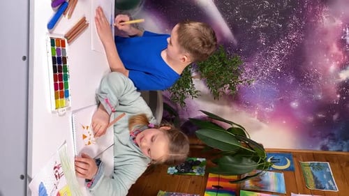 Children Drawing at Table in Home Setting