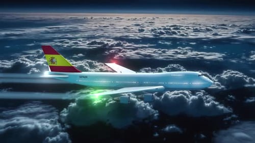 Spanish Passenger Airplane Flying Over Clouds at Dusk