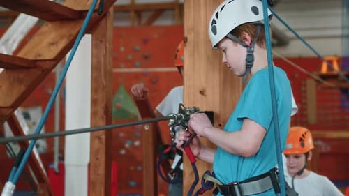 A Portrait of a Brave Boy Passes an Obstacle Course at a Rope Park