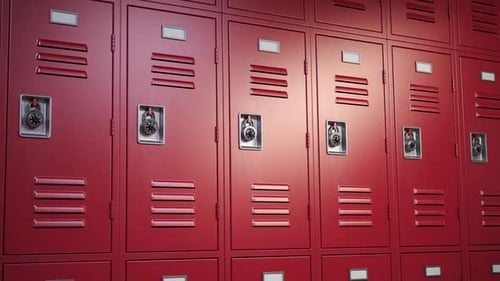 Row of closed ameriocan football locker room and one opened with football attributes