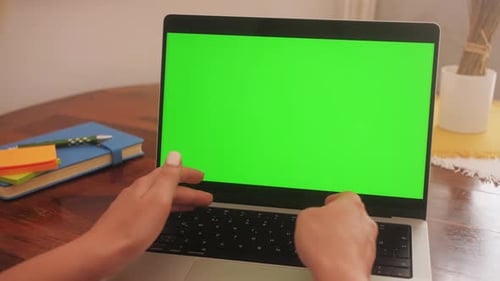 Hands Typing on a Keyboard Laptop with Green Screen Modern Laptop with Mockup Green Screen Display