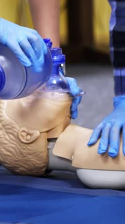 Healthcare Professional Demonstrates Rescue Breathing Techniques