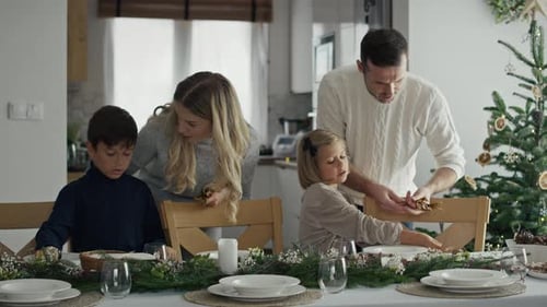 Family Prepares Festive Table for Holiday Dinner