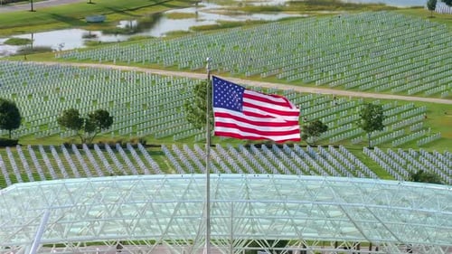 American Flag Waving over National Cemetery in Daytime