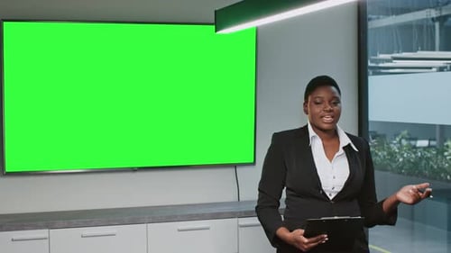 Young African American Woman Leading a Corporate Presentation
