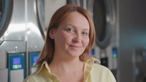 Elegant Woman Portrait Before Industrial Laundry Dryers Clothes Rolling