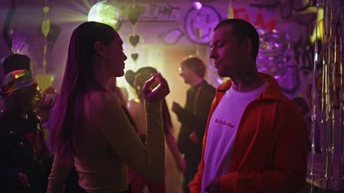 Relaxed Man Dancing Woman at Neon Light Club Party Closeup Carefree Couple