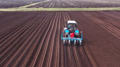 Tractor with Seeder in the Field