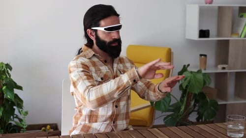man using futuristic virtual reality glasses works in the metaverse