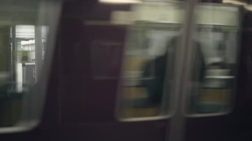 Fast blurry commuter train in Tokyo.