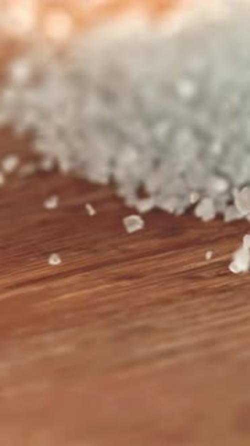 Salt Crystals on a Wooden Table Filmed on a Highspeed Camera at 1000 Fps