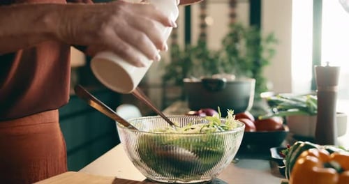 Cooking, salad and hands with utensils in kitchen, nutrition and meal prep with ingredients and oil
