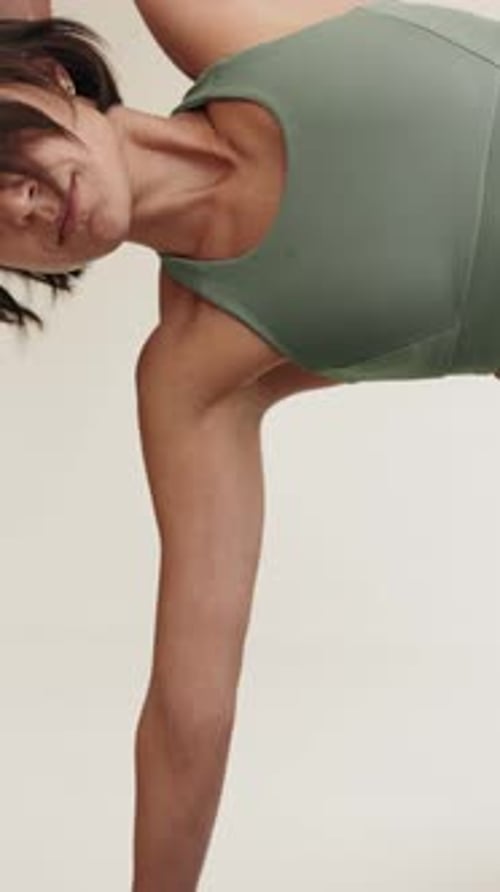 CloseUp View of Female Yoga Practitioner Stretching