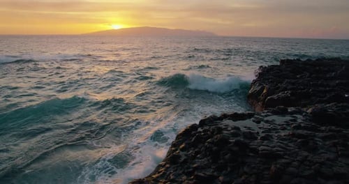Sea Water Crash on Rocks During a Beautiful Colourful Sunset in Slowmotion