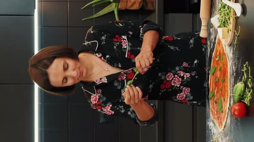 Woman making italian pizza Margherita