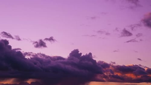 Clouds Moving Across Colorful Sunset Sky