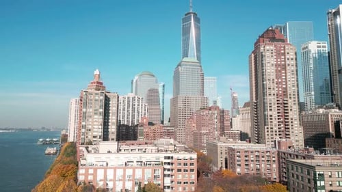 Manhattan View From Above Blue Sky Forwards Fly Above Street Between Modern Buildings Day in