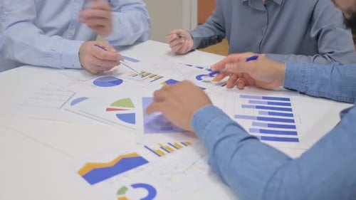 Close up of Business People Working on Documents