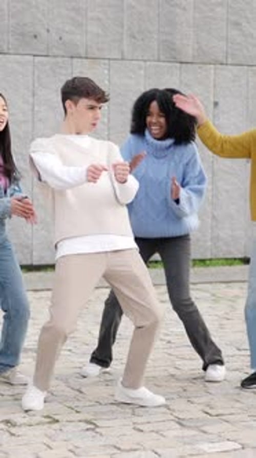 Multiethnic Happy Friends Dancing in the City