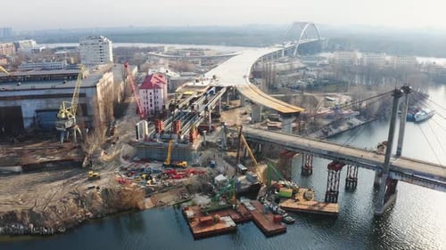 Aerial view of Podilsko-Voskresensky Bridge. Bridge is under construction. Podilskyi Metro Bridge