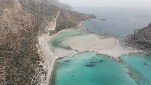 Aerial drone view of Balos beach, covered with fine white sand and located between the two creeks of