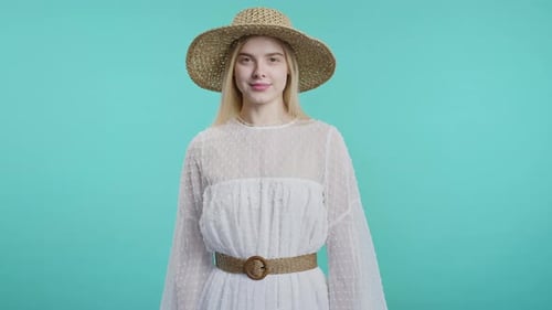 Woman in Dress and Sun Hat Smiling