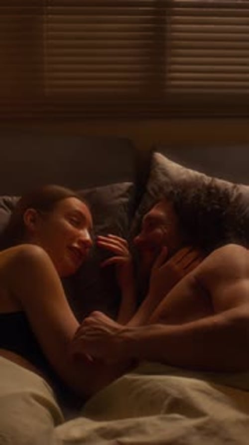 Romantic Couple Lying Together in Bed, Intimate Moment