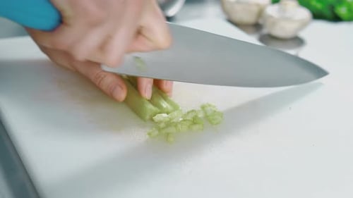 Dicing Fresh Celery on a Cutting Board