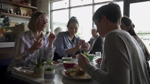 Women Friends Brunching at Cafe Table