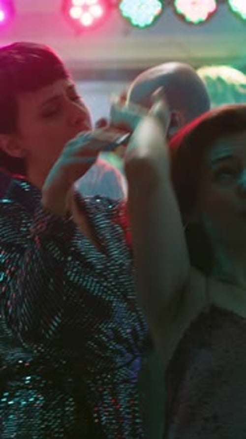 Adults Dance Together at Nightlife Event