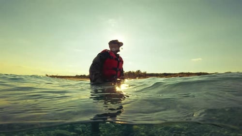 Soldier Walks in the Sea Water